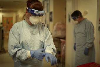 Image of hospital staff wearing full PPE.